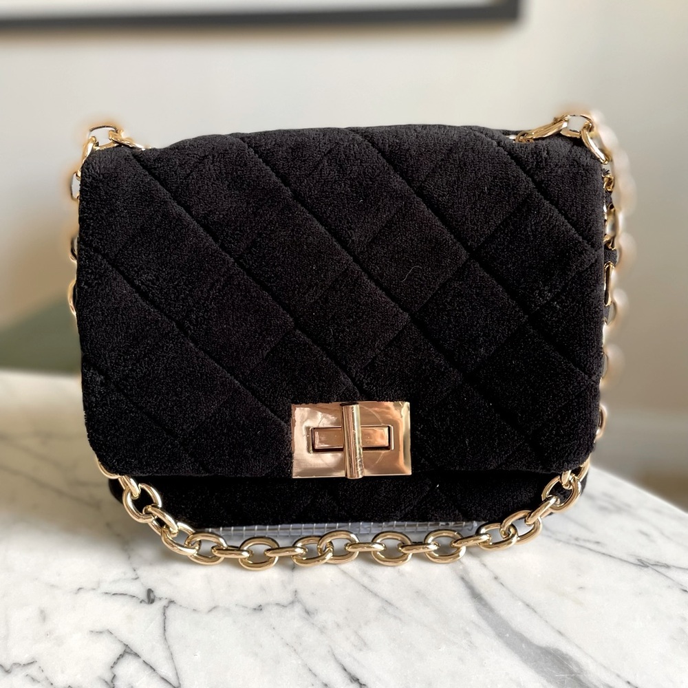 Urban Expressions black quilted fabric shoulder bag with gold chain/turn lock.